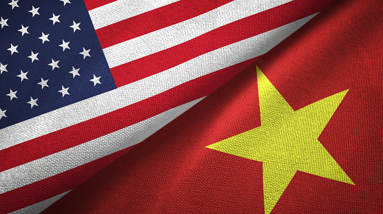 Vietnam and United States flags together textile cloth, fabric texture
