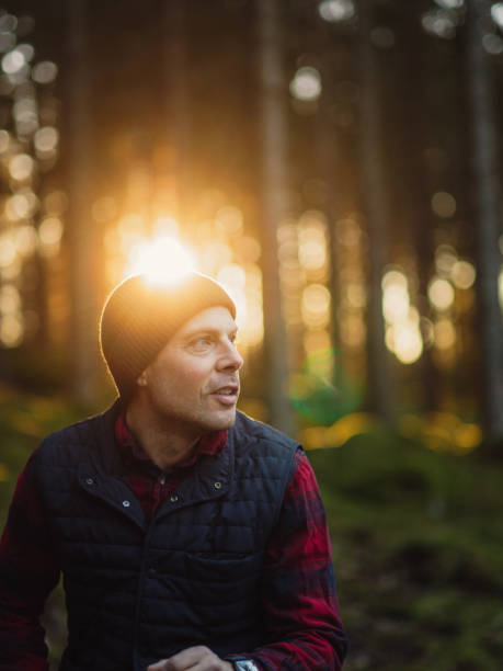istock Man outdoors walking in forest nature rural scene 1096900404