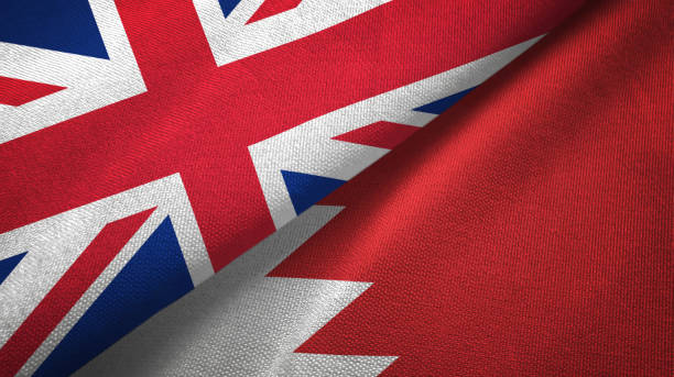 istock Bahrain and United Kingdom two flags together textile cloth, fabric texture 1096903314
