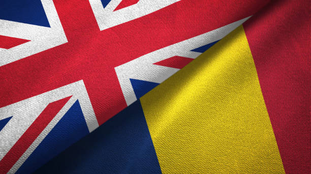 istock Chad and United Kingdom two flags together textile cloth, fabric texture 1096904374
