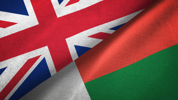 istock Madagascar and United Kingdom two flags together textile cloth, fabric texture 1096905018