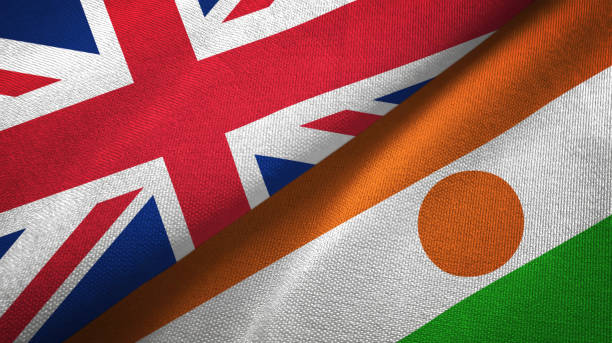 istock Niger and United Kingdom two flags together textile cloth, fabric texture 1096905206