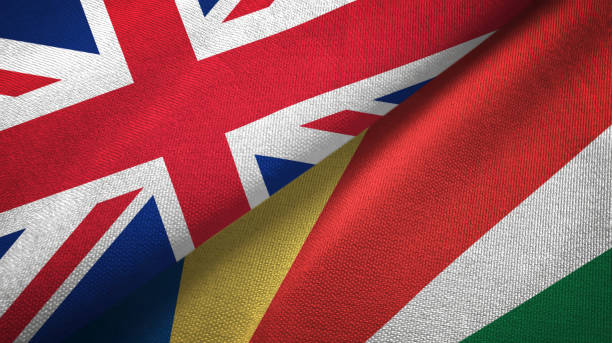 istock Seychelles and United Kingdom two flags together textile cloth, fabric texture 1096905584