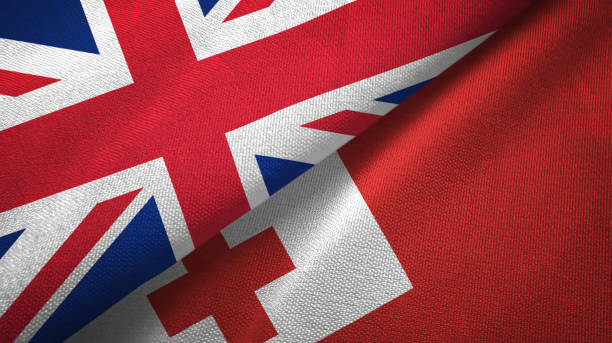 istock Tonga and United Kingdom two flags together textile cloth, fabric texture 1096905660