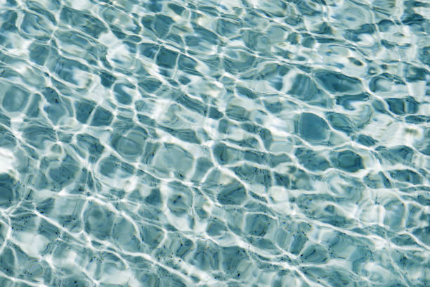 istock Sunlight and surface of a swimming pool 1096906168