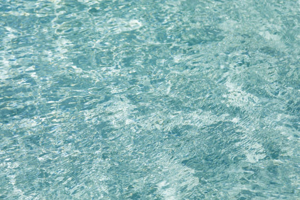 istock Sunlight and surface of a swimming pool 1096906928