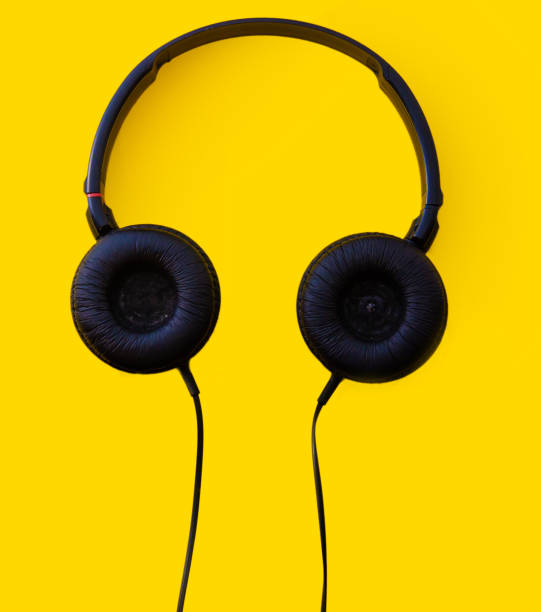 istock headphones on a yellow background 1096907192