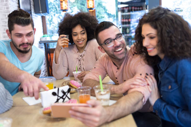 istock Young people enjoying time together in cafe 1096911040