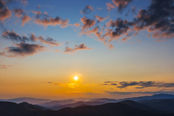 istock mountain ridge silhouette in a blue mist at the sunset 1096912990