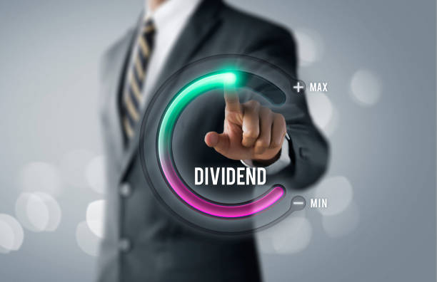 istock Dividend growth or increase dividend concept. Businessman is pulling up circle progress bar with the word DIVIDEND on bright tone background. 1096918280