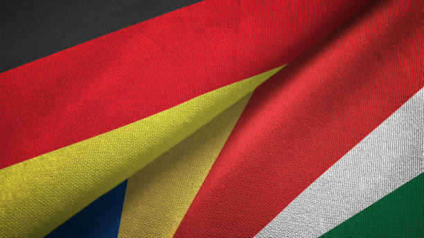 istock Seychelles and Germany two flags together textile cloth, fabric texture 1096919260