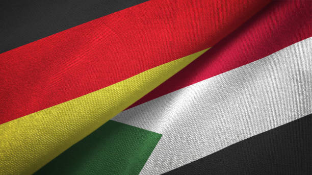 istock Sudan and Germany two flags together textile cloth, fabric texture 1096919408