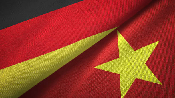 istock Vietnam and Germany two flags together textile cloth, fabric texture 1096919654