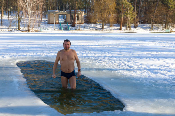 istock Man poses for the camera after dipping into an ice hole 1096920290