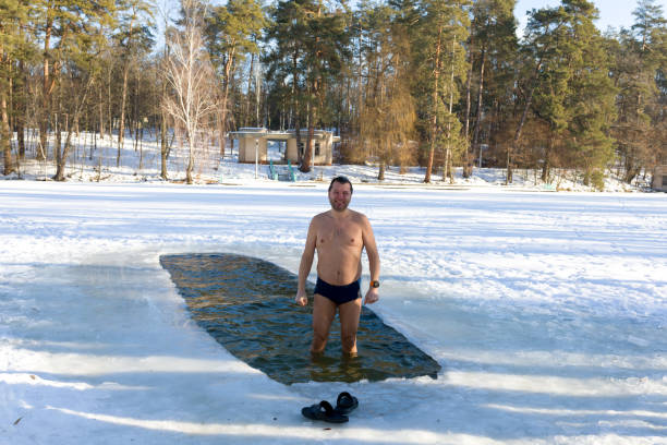 istock Man poses for the camera after dipping into an ice hole 1096920298