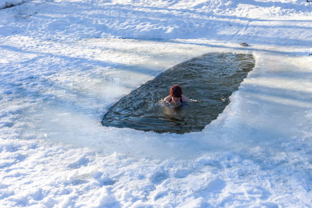 istock Woman dives into ice water 1096920336