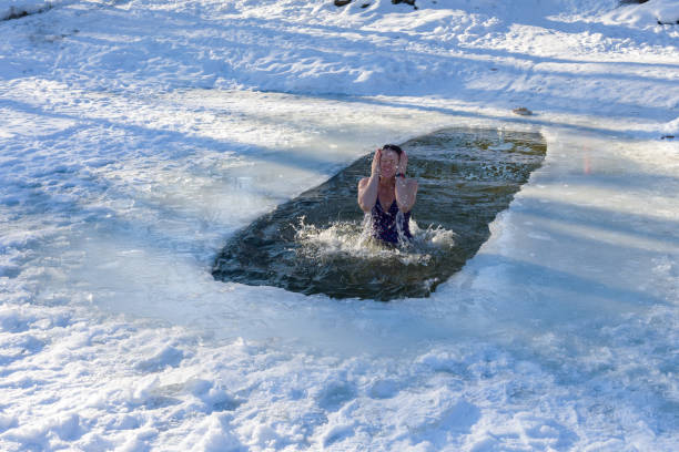 istock Woman dives into ice hole 1096920348
