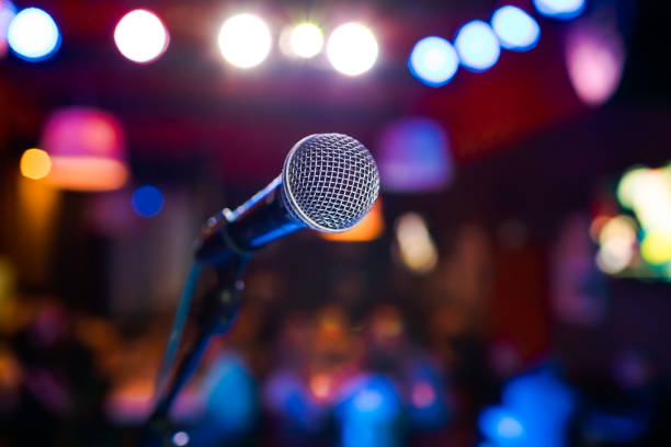 istock Microphone on stage against a background of auditorium. 1096921672