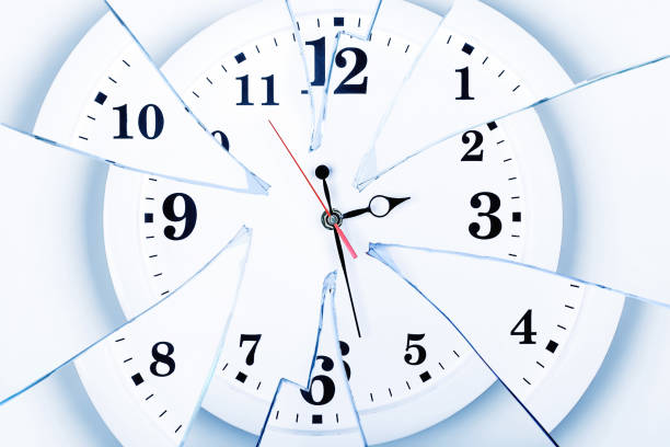 clock with broken glass on a white background. chaos time. time passing concept. Frustration time, plans of business, life.