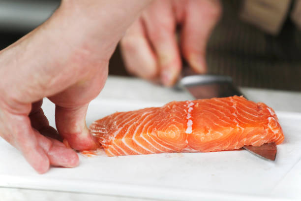 istock Taking the skin of the fresh Sajmon filet 1096925310