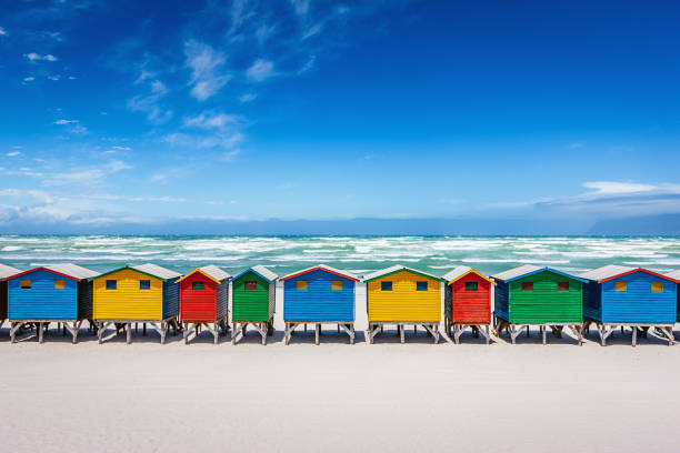 Muizenberg Colorful Beach Huts Cape Town South Africa Beautiful colorful beach huts on the white sandy beach of Muizenberg, Cape Town, South Africa. beach hut photos stock pictures, royalty-free photos & images