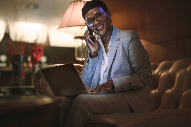 istock Businesswoman on trip working from hotel lobby 1096928698