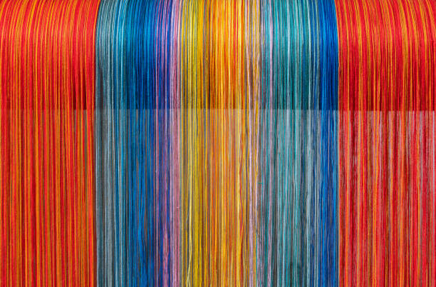 istock Colored threads of an ancient wooden loom 1096929214