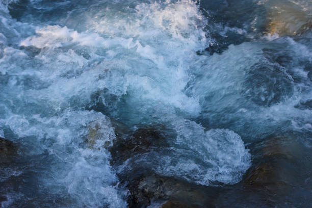 istock Blue flowing water stream of mountain river 1096932384