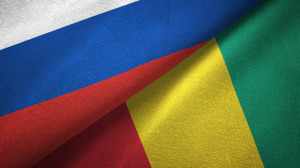 istock Guinea and Russia two flags together textile cloth, fabric texture 1096932986