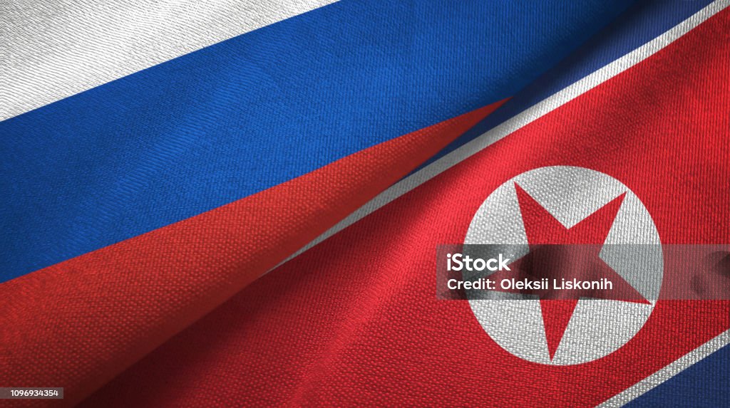 North Korea and Russia two flags together textile cloth, fabric texture North Korea and Russia flags together textile cloth, fabric texture North Korea Stock Photo