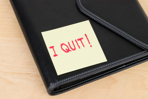 istock Resign quit notice on sticky note with book organizer 1096935850