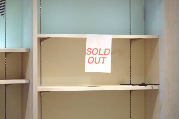 istock sold out sign on empty shelves 1096937652