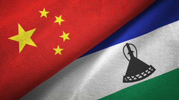 istock Lesotho and China two flags together textile cloth, fabric texture 1096942398
