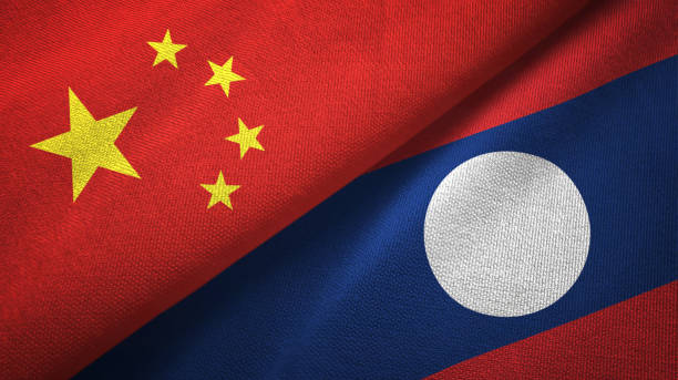 istock Laos and China two flags together textile cloth, fabric texture 1096942508