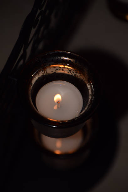 istock burning candle tea lights in wintertime 1096942992