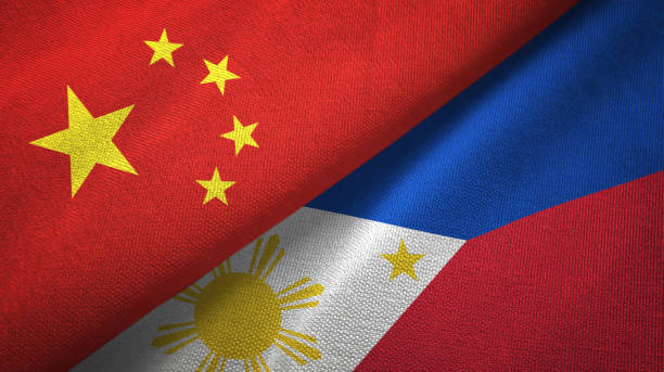istock Philippines and China two flags together textile cloth, fabric texture 1096943558