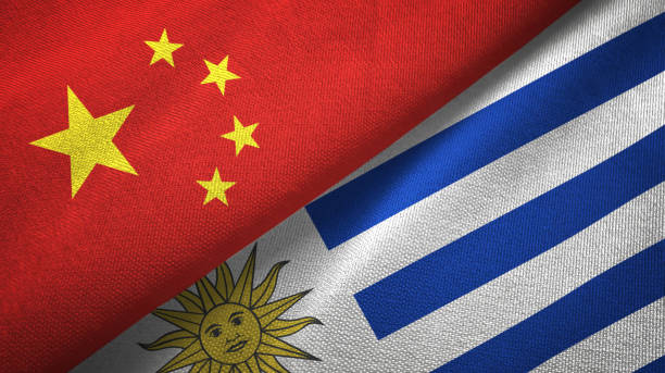 istock Uruguay and China two flags together textile cloth, fabric texture 1096944854
