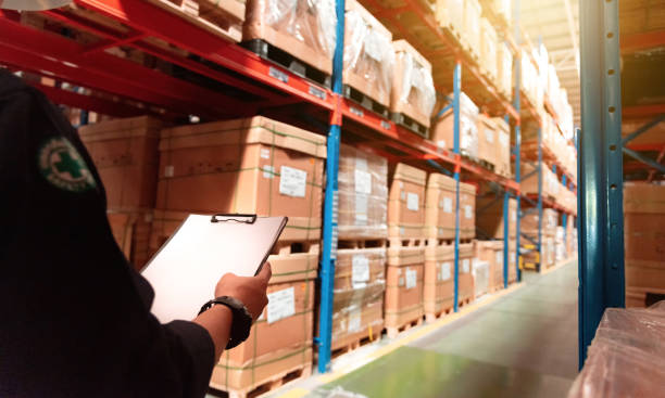 istock working men are checking stock in warehouse. 1096955794