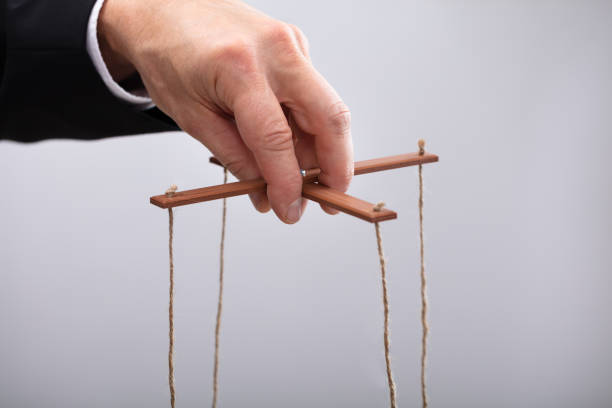 istock Businessperson Manipulating Marionette 1096959930