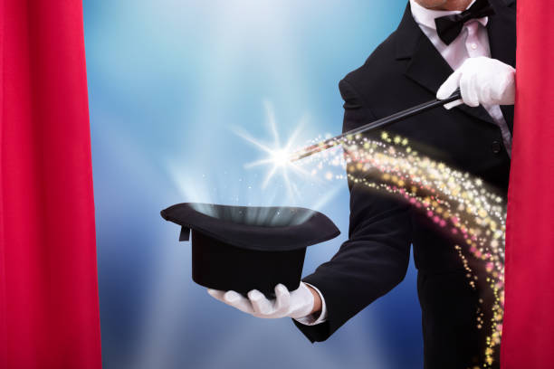 istock Magician's Hand With Wand And Hat 1096959994