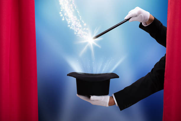 istock Magician's Hand With Wand And Hat 1096959998