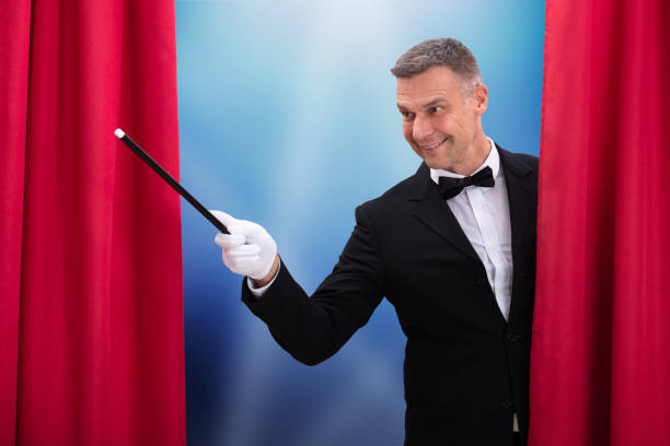 istock Happy Magician Holding Magic Wand 1096960002