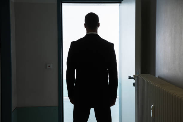 istock Businessman Standing In Front Of Open Door 1096960040