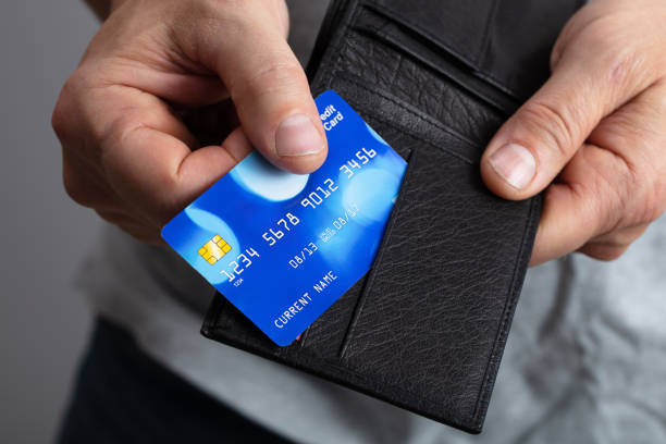 Person Removing Credit Card From Wallet Selective Focus Of A Person's  Removing Credit Card From Wallet wallet photos stock pictures, royalty-free photos & images