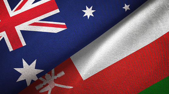 Oman and Australia flags together textile cloth, fabric texture