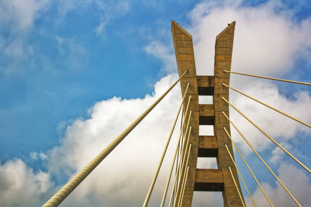 istock Section of a cable-stayed bridge against a vibrant blue sky 1096967992