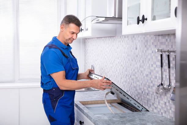istock Repairman Installing Induction Stove 1096969722