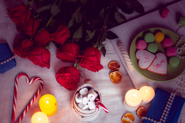 istock Candlelight dinner with red roses and gifts 1096971040