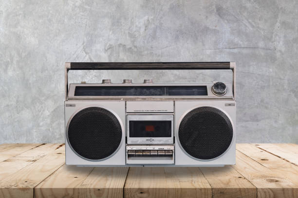istock Vintage stereo on wooden table and concrete  wall texture and background. 1096973796