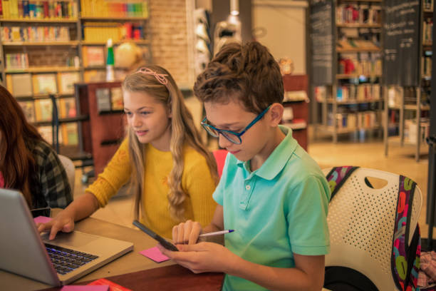 istock group of friends studying together in the library 1096974212